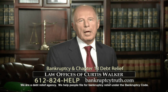 Curtis Walker stood in his office in front of a bookcase full of law books, explaining bankruptcy